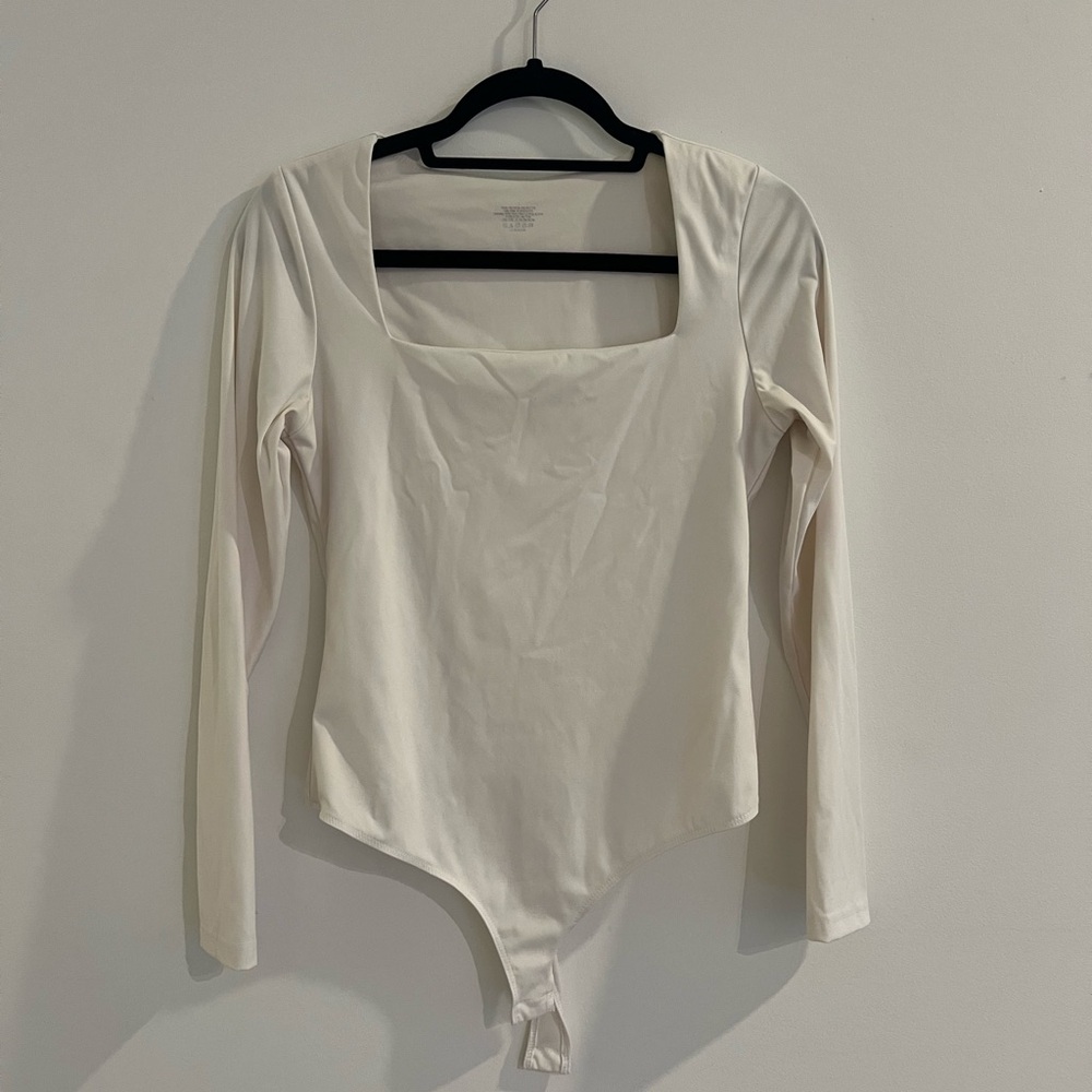 Cream Fitted Bodysuit with Snap Closures